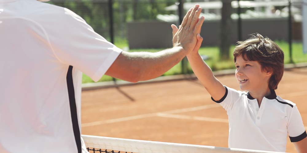 Tennis Kid Handshake with the coach